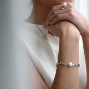 women wearing matching jewellery set with pearls